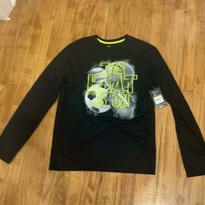 black long sleeve shirt with sports balls on it that says “the heat is on”